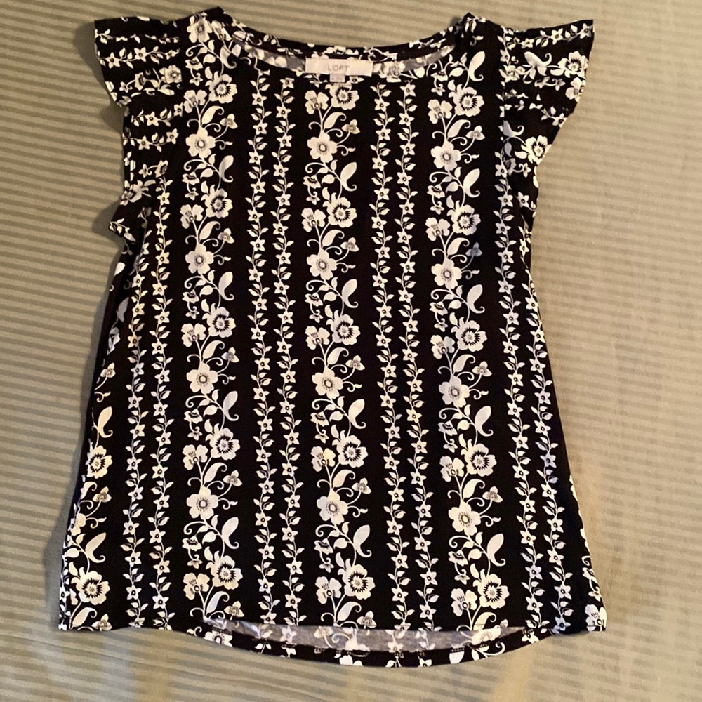 Loft, Black Blouse with White Floral Design..  Ruffled Cap Sleeves..